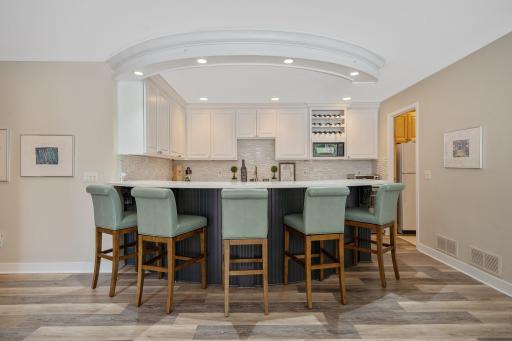New wet bar in the lower level. Room to the right is additional storage with a full size refrigerator and the 2nd laundry room.