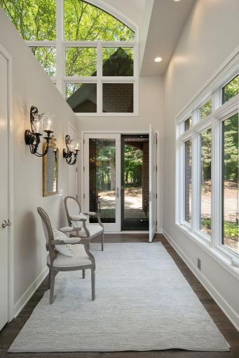 Welcoming entrance is bright and inviting with a wall of windows.