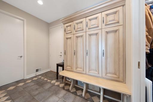 Entrance from the garage includes lockers, walk in closet and the main floor laundry room.