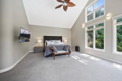 Floor to Ceiling windows that wrap around for pool and lake views, soaring vaults, generous square feet is a perfect private retreat.