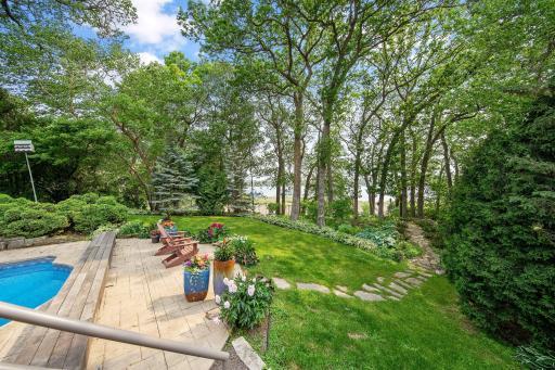 Walking path to the lake and your boat with a fire pit area.