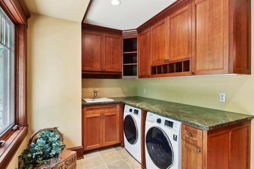 The large first floor laundry also serves as a butlers pantry.
