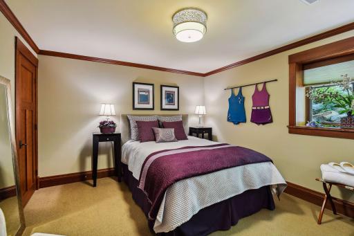 Cozy lower level bedroom with egress window and closet.