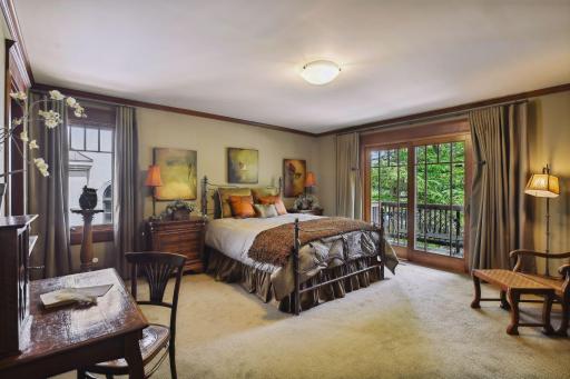 This bedroom features a balcony facing the lake.