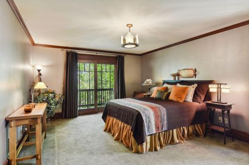 This bedroom features a sliding door to the backyard balcony.