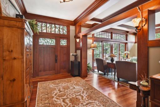 Welcoming large front foyer with stained glass and rich American Cherry columns.
