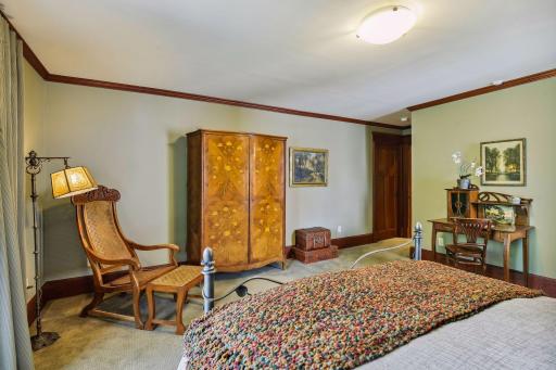 This spacious room accommodates many bedroom furniture pieces.