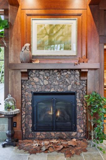 The gas fireplace clay tile "Falling Leaves" surround won first place in an international design competition.