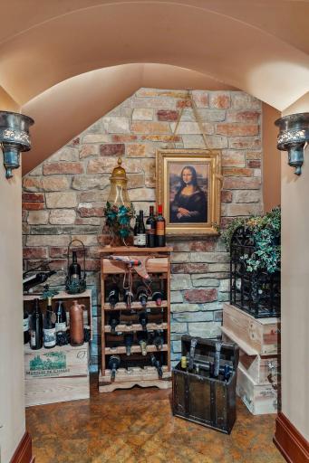 Notice the fun Italian-inspired wine closet in the hall. There's also a subterranean room that maintains a natural even temperature year round creating a real wine cellar.