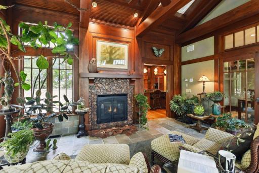 Distinguish yourself in the conservatory featuring vaulted ceilings and Bluetooth enabled shades.