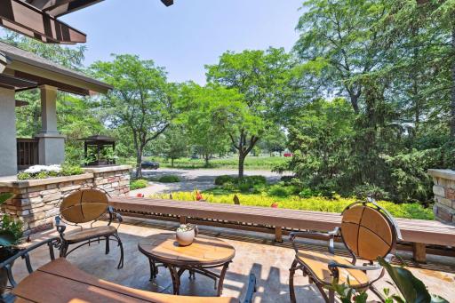 Front patio overlooks a lush landscape design.