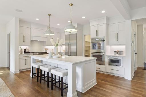 Kitchen with quartz countertops & double ovens