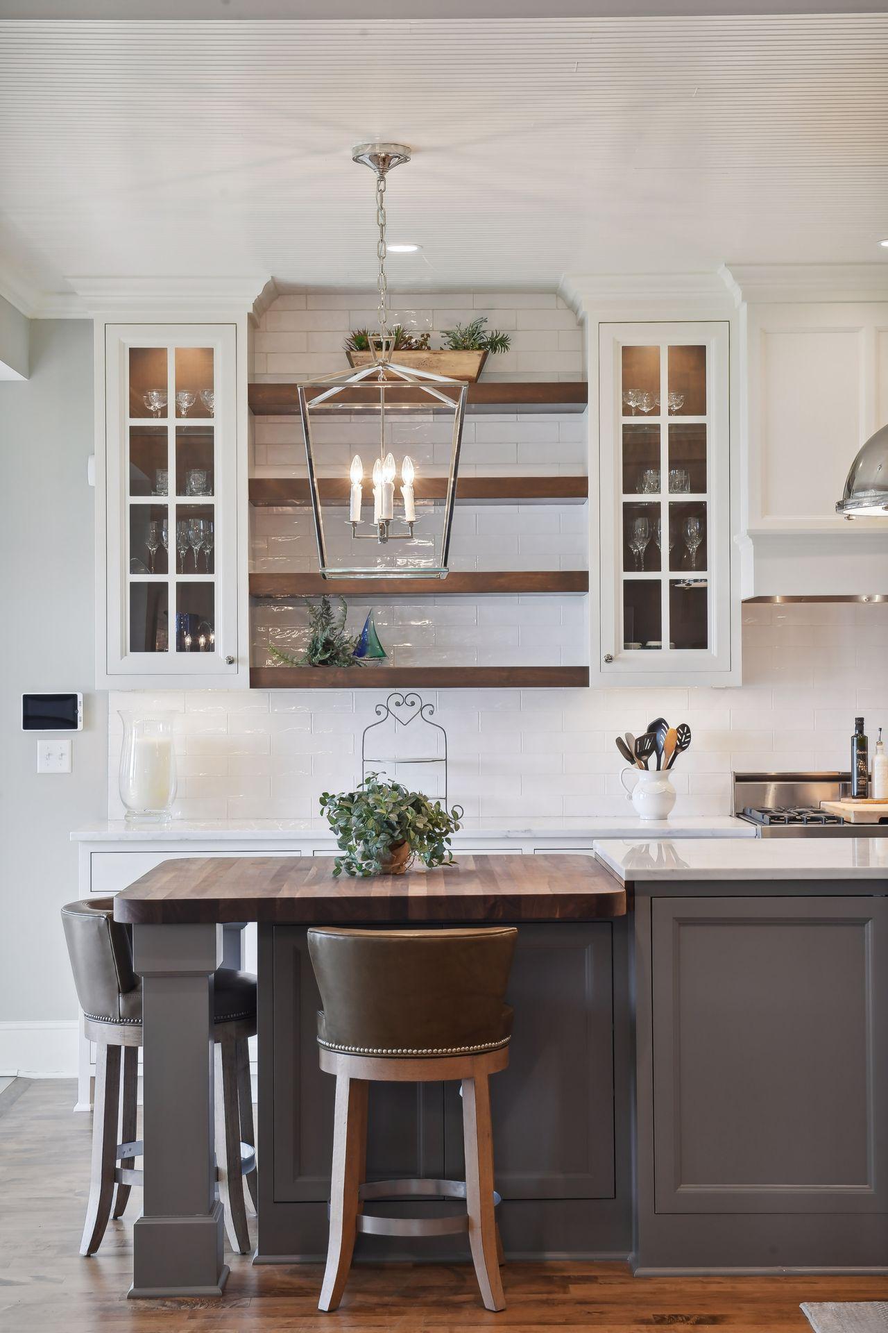 The custom sitting area features hidden cabinetry for additional storage.