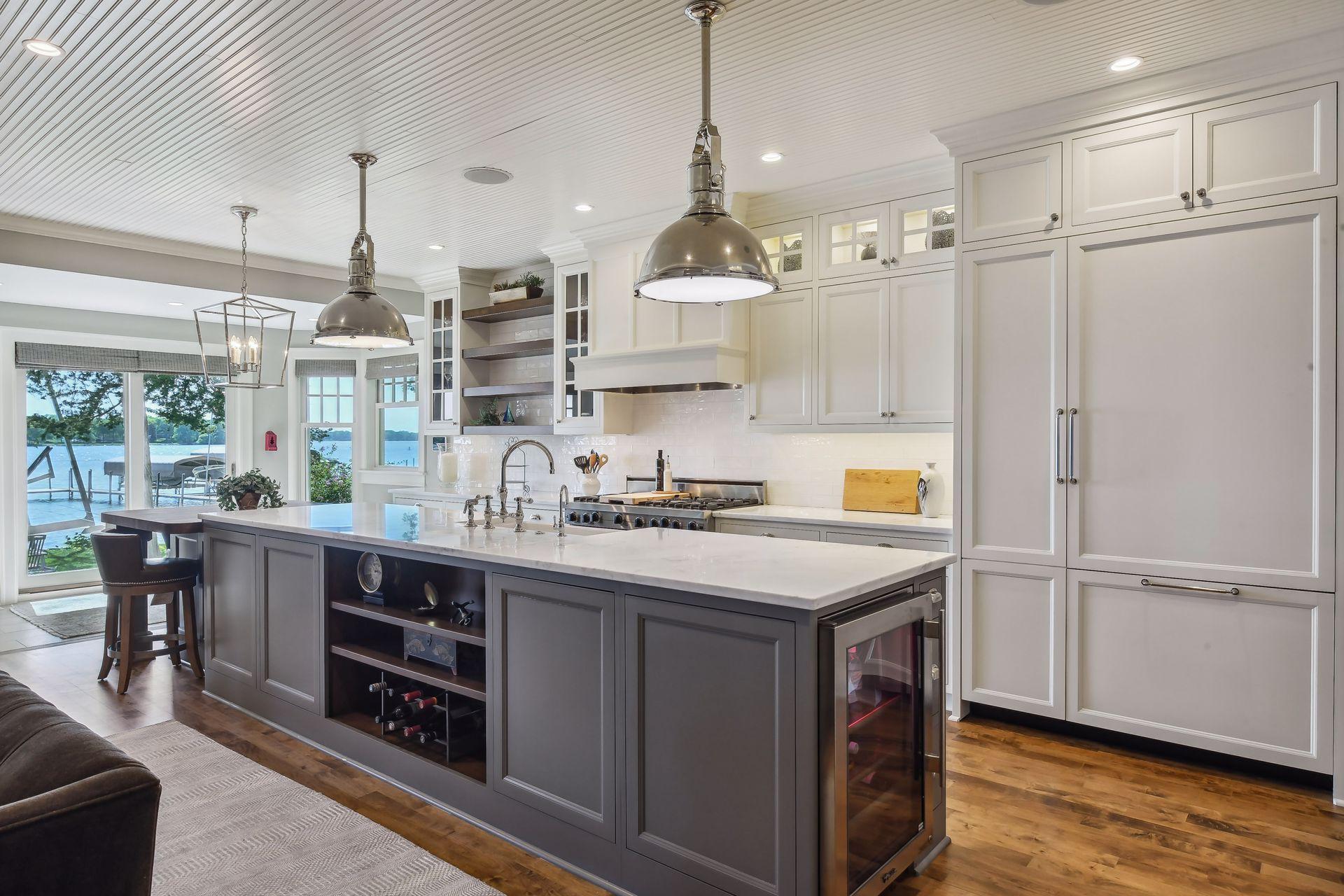 Completely renovated, the main level enjoys a spacious designer Kitchen with custom cabinetry and professional appliances.