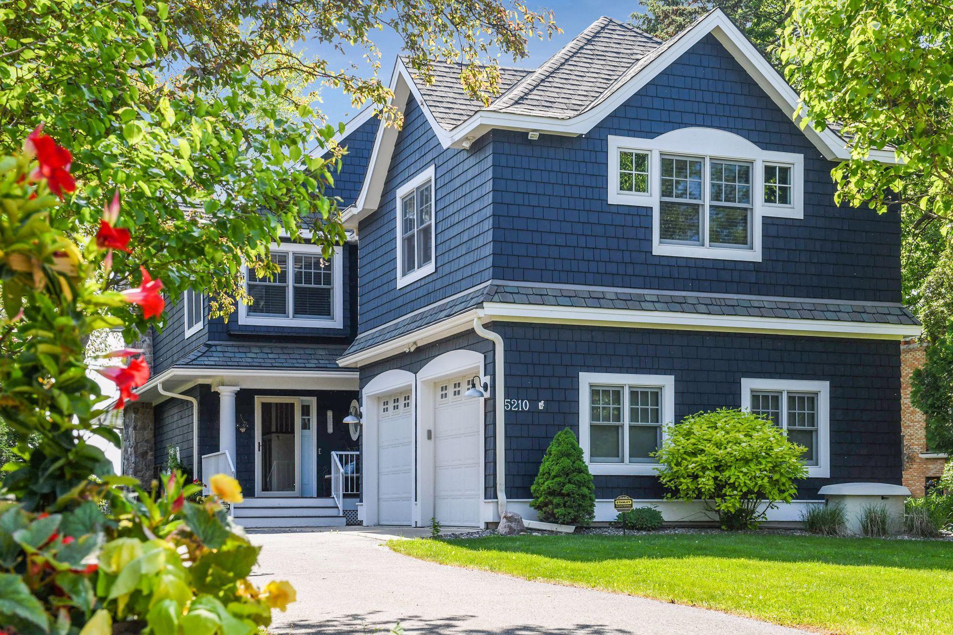 Beautifully refreshed from pillar to post, this custom home brings a little bit of the Hamptons to the shores of Lake Minnetonka.