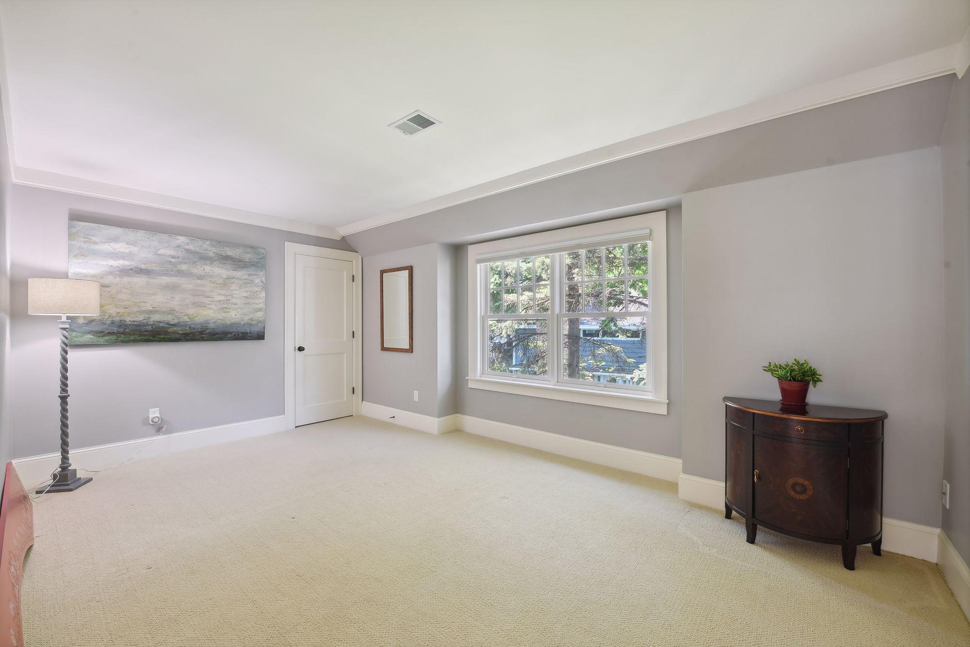 The second Junior Suite features crown molding and a walk-in closet.