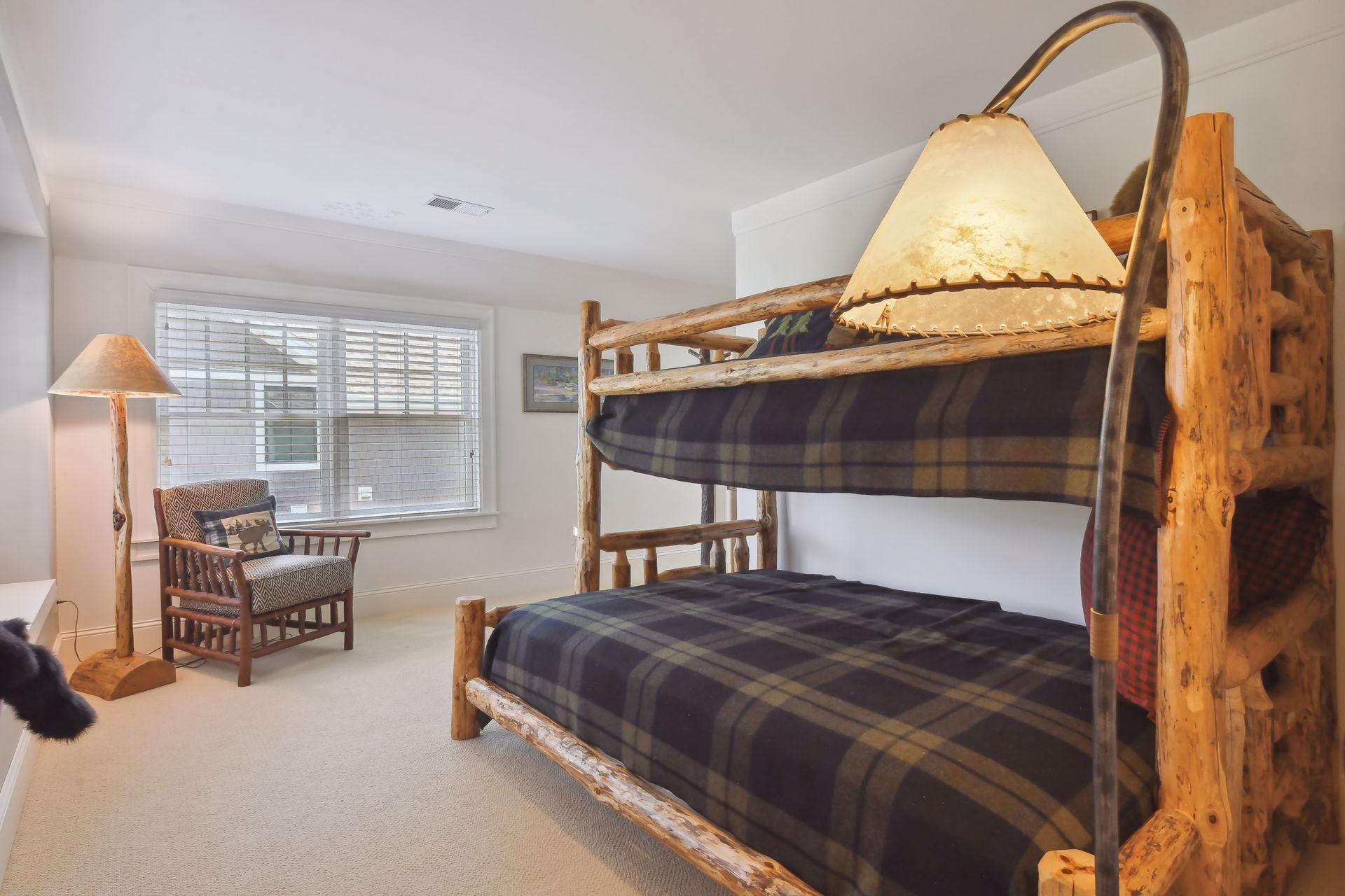 In addition to the Primary Suite, you will find this large Junior Suite which features a walk-in closet on the upper level.