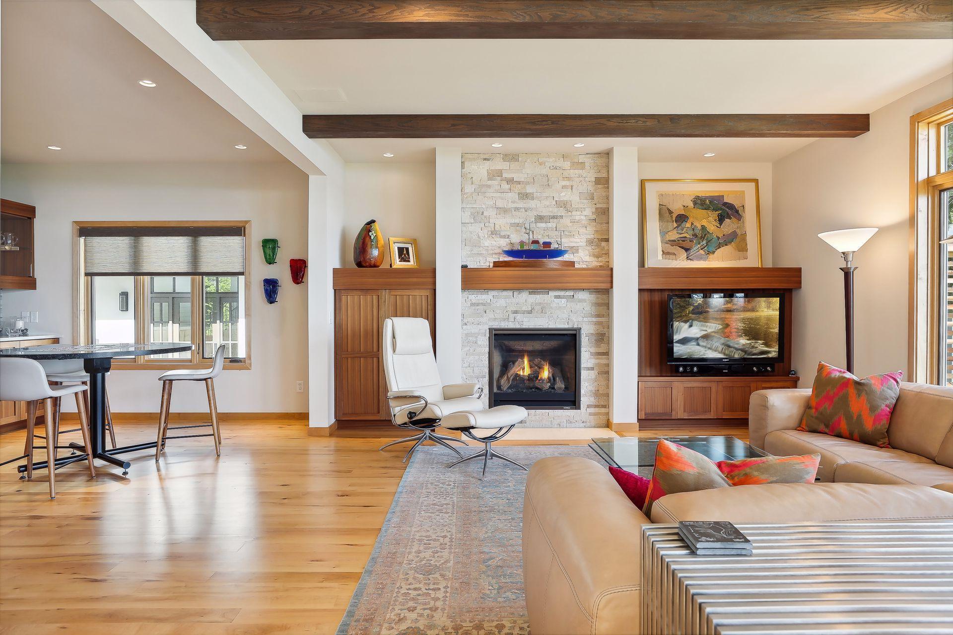 Open flow to the home’s dining area on one side and the wet bar/informal dining on the other