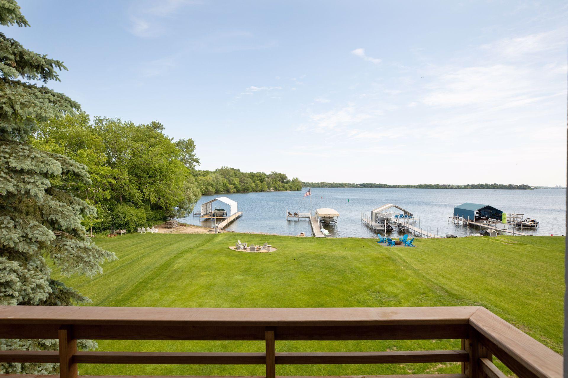 Spacious and flat backyard of manicured lawn.