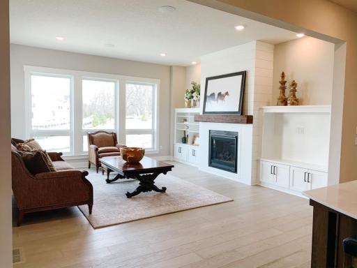 Photo from a similar home in another community. This home will have a coffered ceiling and a stone fireplace. Colors will vary. Built ins will vary.
