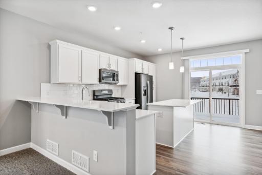 Additional breakfast bar. Photos are not of actual home. Actual home will be similar. Some colors and features may vary.