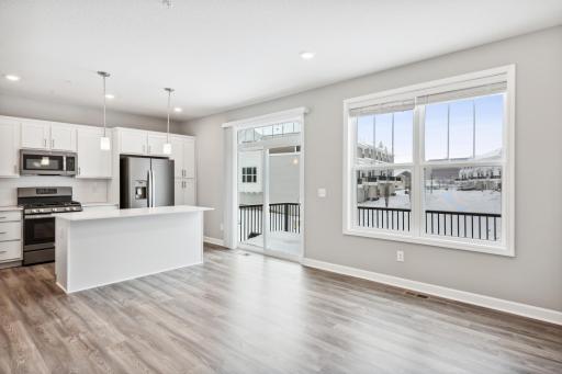 Plenty of windows and a sliding glass door for natural light and sunshine. Photos are not of actual home. Actual home will be similar. Some colors and features may vary.