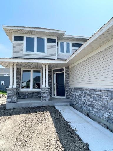 The stone accents along the sidewalk and front porch make a statement at your front entry. Photos are of the actual home.