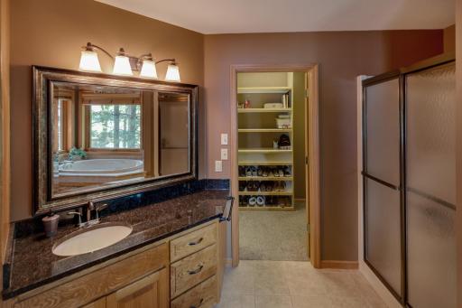 Primary bath leads into the walk-in closet.