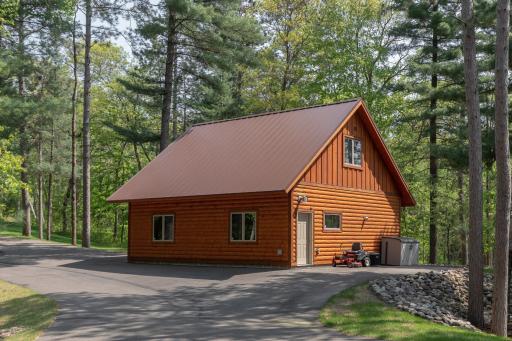 Heated garage space, guest quarters above and a metal roof ~ Awesome design!