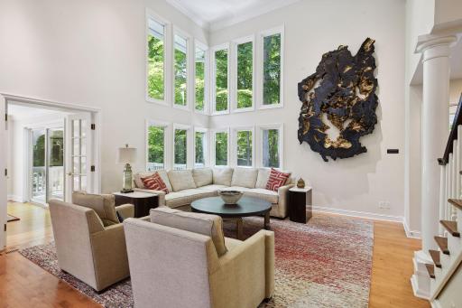 Floor to ceiling windows flood the room with light