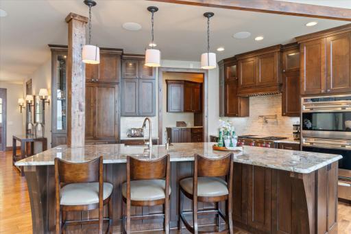 14' granite center island and Sub Zero integrated refrigerator
