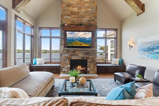 Floor to ceiling stone fireplace and hand scraped beams