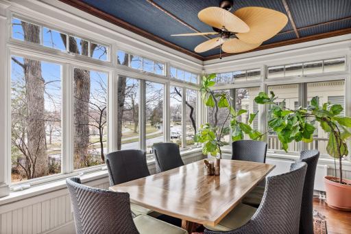 Oversized sunroom provides plenty of space for dining.