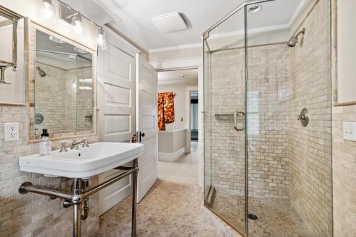 3rd floor full bathroom has walk-in shower and separate tub.