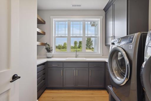 Laundry room with sink and storage