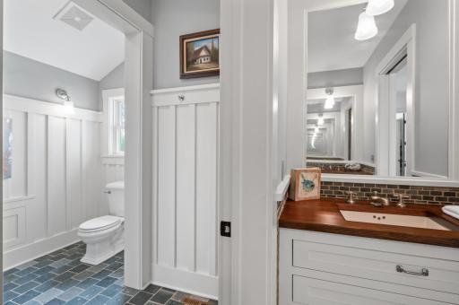 The bathroom includes separate sinks, providing individual space and convenience.