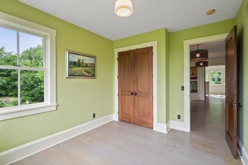 The bedroom includes a spacious double door closet, providing ample storage for clothing, accessories, and other personal belongings.
