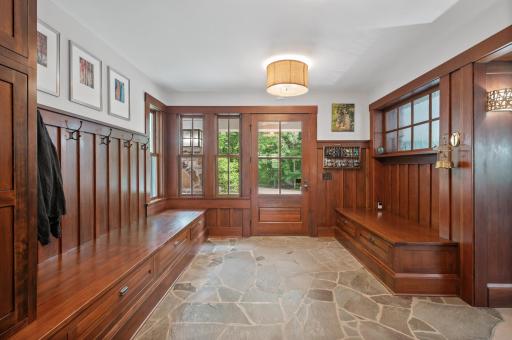 As you step into the home, you'll be greeted by a beautiful entryway featuring custom built-in drawers and benches.