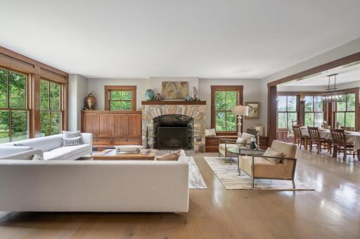 This living room features oak floors that are heated, providing warmth and comfort underfoot.
