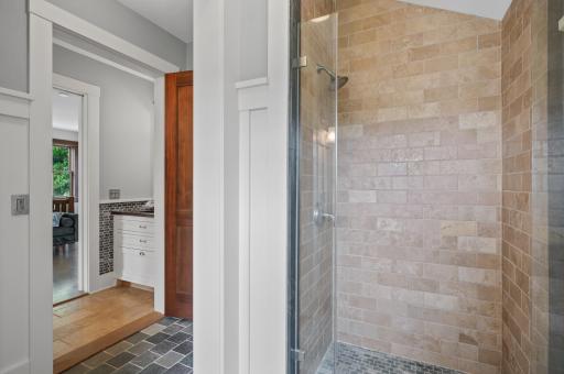 The bathroom features a standalone shower.