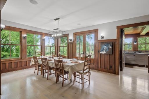 It is conveniently connected to the outdoors through a double door that opens onto a terrace, allowing for easy access to fresh air and natural light.