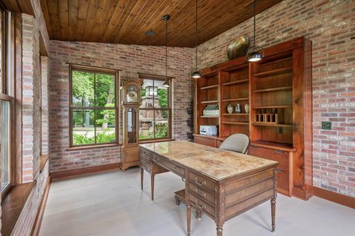 This built-in shelving and drawer unit combines the functionality of lateral file cabinets for organized file storage with a counter space and custom bookshelves made of Douglas fir.