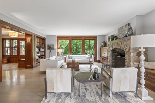 The living room also boasts custom floor to ceiling windows that bathe the room in natural light.