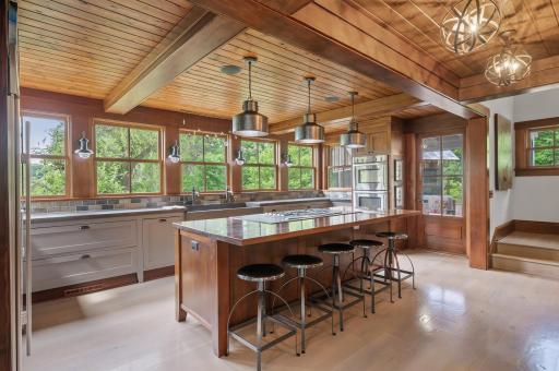 A side door leads to a screened-in patio, providing a convenient access point to outdoor areas.