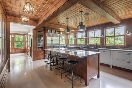 The kitchen is equipped with eight large windows, allowing plenty of natural light to fill the room and offering views of the surrounding area.