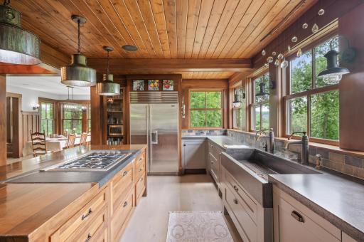 The kitchen is equipped with a high-quality stainless steel Sub-Zero industrial refrigerator and freezer.