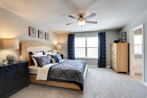 A beautiful primary suite with large windows and a large walk in closet. This oasis will be inviting to you after a long day! MODEL HOME PHOTOS, COLORS AND SELECTIONS WILL VARY.