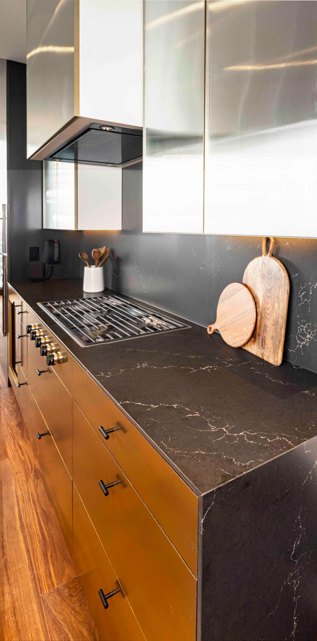 Modern Urban finish palette includes Cambria waterfall countertop, walnut wide plank flooring & trim. Photos courtesy of Cambria.