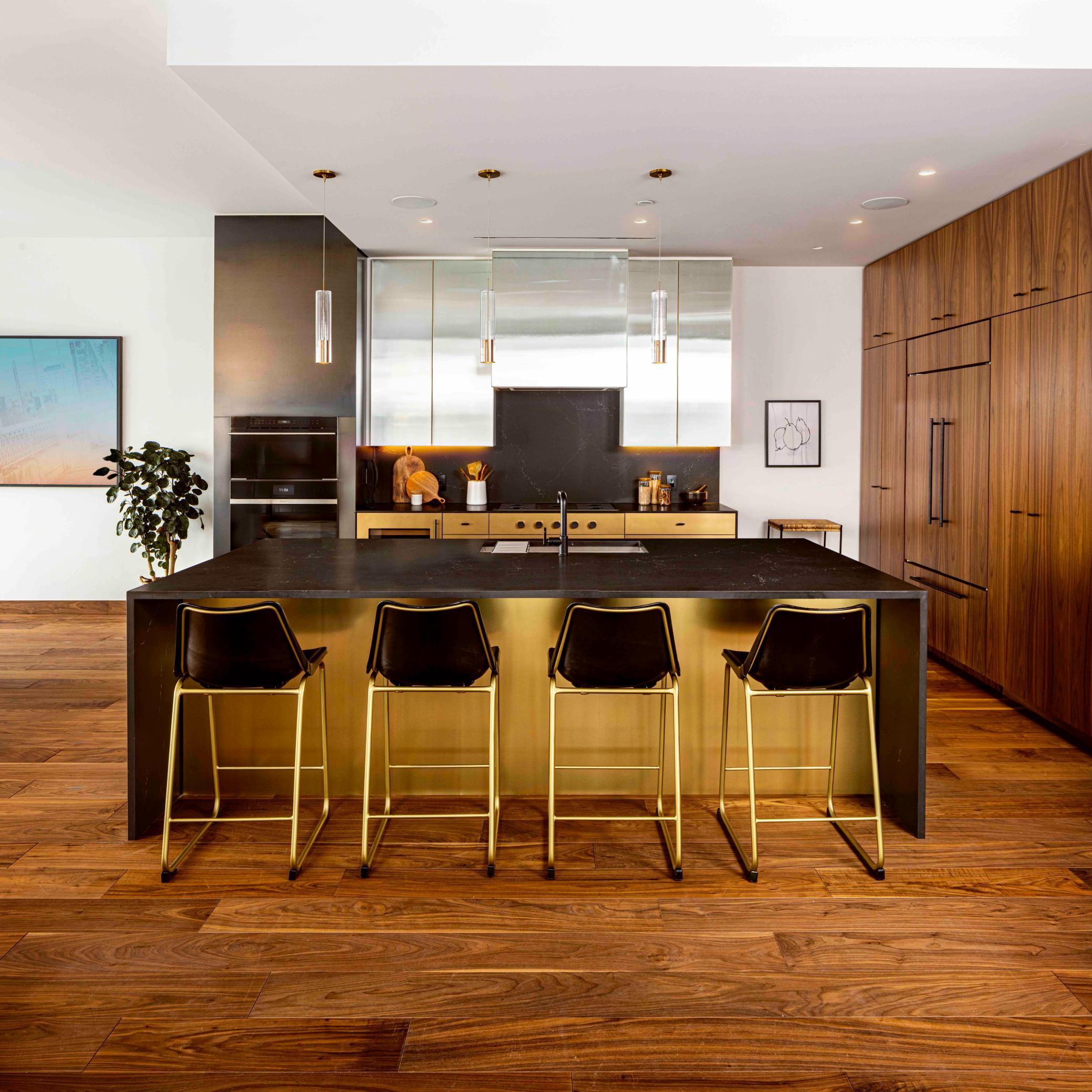 Modern Urban finish palette includes Cambria waterfall countertop, walnut wide plank flooring & trim. Photos courtesy of Cambria.