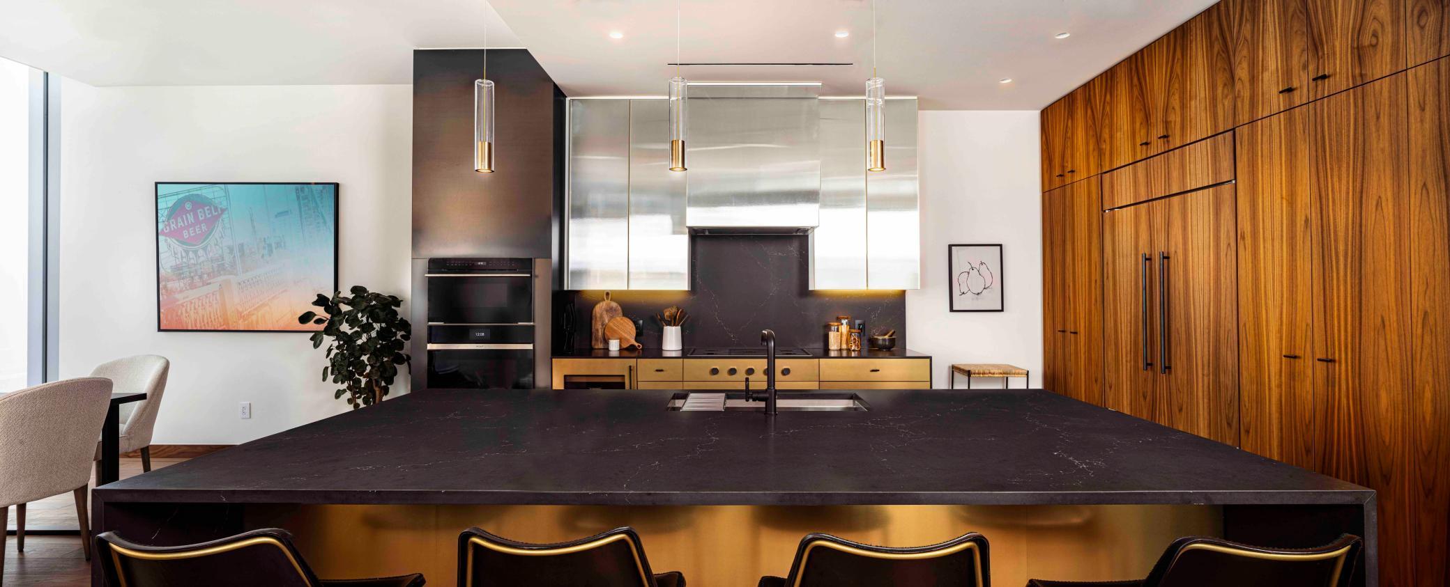 Modern Urban finish palette includes Cambria waterfall countertop, walnut wide plank flooring & trim. Photos courtesy of Cambria.